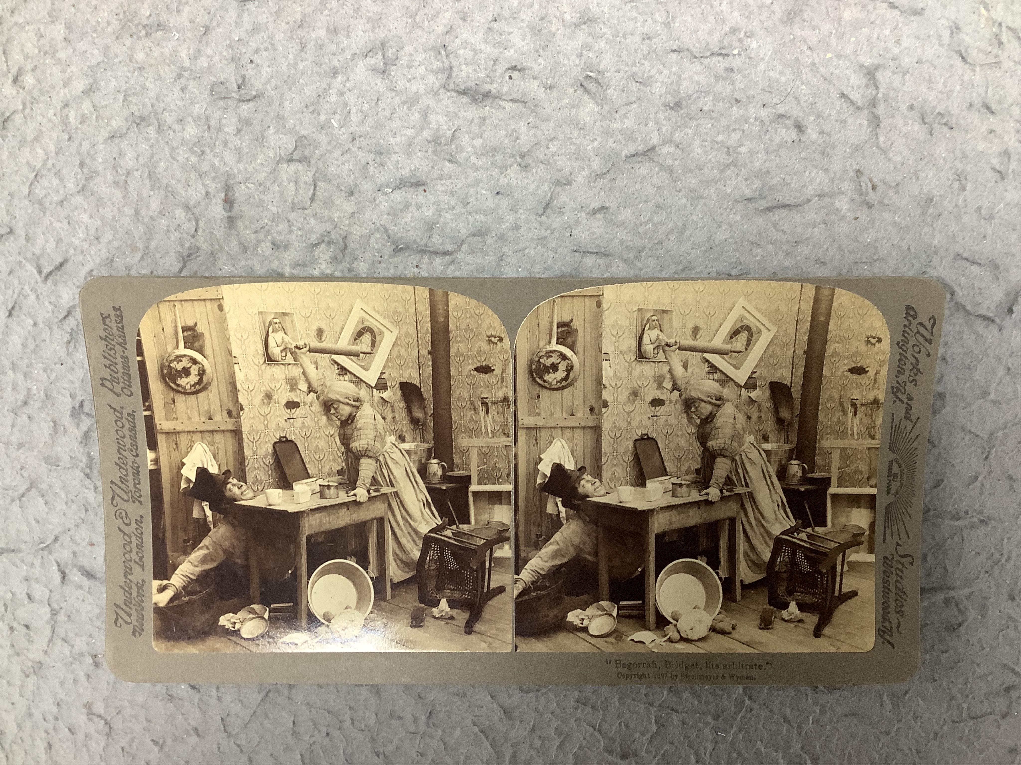 A stereoscope viewer with a collection of comical viewing cards. Condition - cards - fair/good, viewer - poor